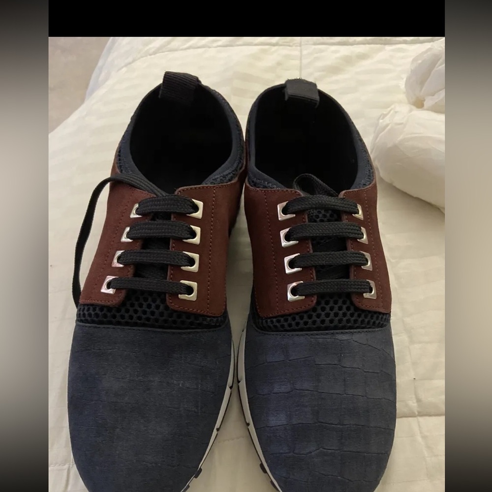 Only worn a couple of time. Jimmy Choo sneakers size 10
